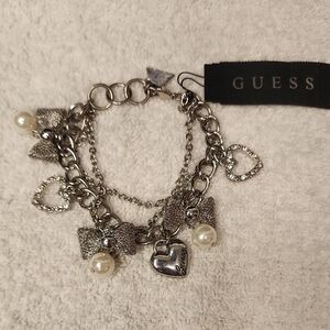 Guess Silver-Tone Charm Bracelet with Pearl Drops and Ribbon Bows